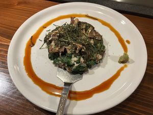 Vegan okonomiyaki - seasonal vegetables including spinach, burdock root, nagaimo, etc. with soy sauce and wasabi. at TEPPANYAKI RAI in Ninohe