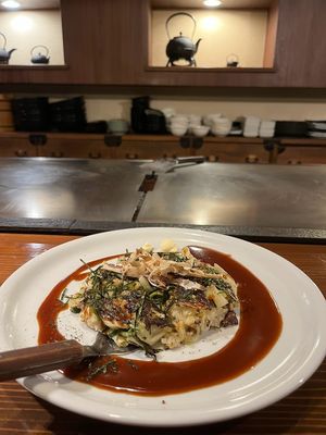 Vegan okonomiyaki with cabbage, green onion, burdock root, etc. and vegan okonomi sauce at TEPPANYAKI RAI in Ninohe