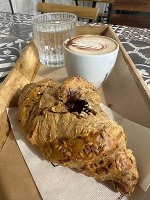Soy cappuccino, vegan croissant with hazelnut cream at Rosebymary in Milan