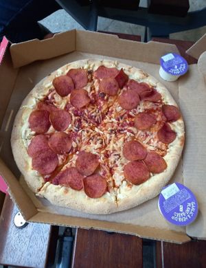 Vegan pepperoni pizza with garlic dips at Domino's Pizza in Hertford