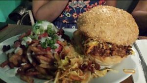 Loaded fries with pulled pork burger at The Hogtown Vegan in Toronto