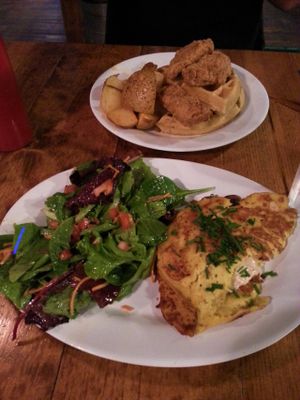 Brunch at Hogtown Vegan. Omelet with salad, and unchicken and waffles with homefries. at The Hogtown Vegan in Toronto