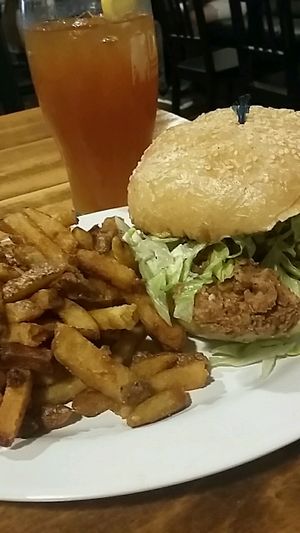 Unchicken with fries and homemade ice tea at The Hogtown Vegan in Toronto