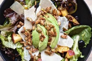 Peach Perfect Salad
Seasonal peaches & blueberries over mixed greens, shaved parmesan, onion, avocado, honey roasted pumpkin seeds finished w/choice of citrus or balsamic vinaigre at Frederick Social in Frederick