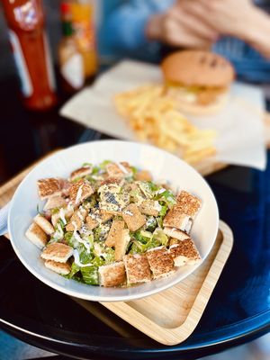 Vegan Caesar salad with fried Balasan tofu, lettuce, tomato, croutons, homemade vegan mayo and chia. at Future Diner in Yerevan