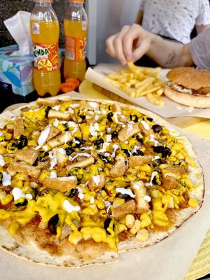 Crispy pizza: pizza sauce, olives, mushroom, corn, crispy tofu, homemade vegan "cheese", homemade vegan mayo at Future Diner in Yerevan