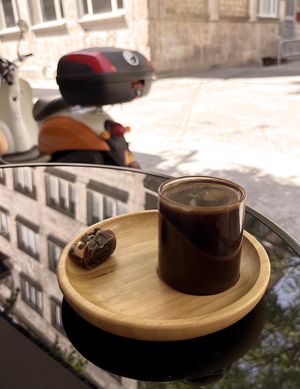 Strong Armenian coffee with date stuffed with peanut creme and chocolate drops at Future Diner in Yerevan