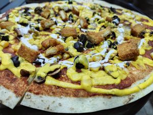 Crispy Pizza:  unfortunately doesn't come with all the ingredients it says on the menu 😡 at Future Diner in Yerevan