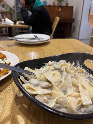 Creamy mushroom pasta with creamy cashew sauce and vegan parmesan. Highly recommend! at Future Diner in Yerevan