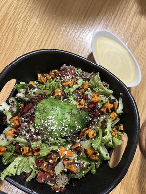 Juicy and crispy Quinoa Salad: cooked quinoa, fresh lettuce, tomato and cucumber, topped with avocado and sweet potato, served with mustard vegan mayo sauce at Future Diner in Yerevan