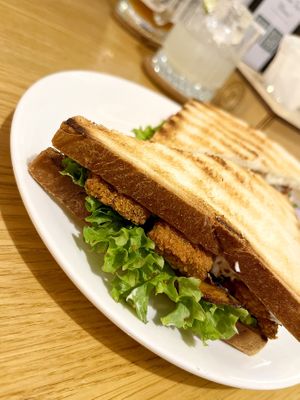 Tofu Club sandwich: crispy tofu sticks in a toast, pickles, tomato, leaf lettuce with tzatziki sauce. Plus grilled oyster mushrooms added upon request. at Future Diner in Yerevan