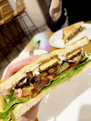 Tofu Club sandwich: crispy tofu sticks in a toast, pickles, tomato, leaf lettuce with tzatziki sauce. Plus grilled oyster mushrooms added upon request. at Future Diner in Yerevan