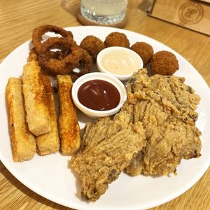 Super Future Mix 2.0: onion rings, crispy tofu, "oyster" wings, potato puffs served with cocktail and soymayo sauces at Future Diner in Yerevan