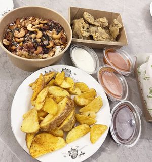 Delivery from Future Diner: divine Fatteh (recommend!), wedgies, sauces, fried "oyster" wings (oyster mushrooms, recommend!) at Future Diner in Yerevan