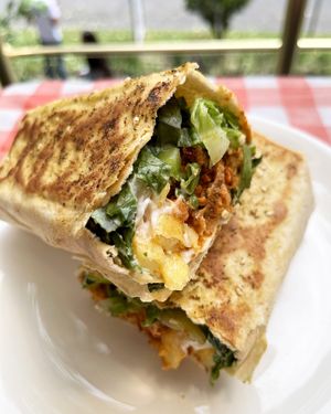 Gorgeous Lebanese shawarma! Fried soy chunks in a rich tomato-cream sauce with Lebanese spices, vegan mayo, pickled cucumber, lettuce, fries in a crispy flatbread at Future Diner in Yerevan