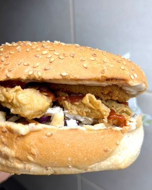Oyster mushroom burger: crispy oyster mushroom, pickled ginger, coleslaw, onion rings, soymayo sauce at Future Diner in Yerevan