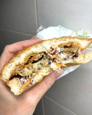 Oyster mushroom burger: crispy oyster mushroom, pickled ginger, coleslaw, onion rings, soymayo sauce at Future Diner in Yerevan