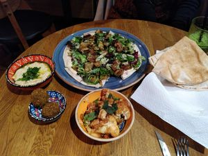 Flat bread with falafel, tahini, and egg plant + babaganoush + falafel + grilled cauli flower. at Ahaaa in Copenhagen