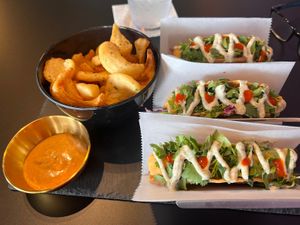 Voodoo Fries with Cajun dipping sauce and East West Tacos.  at Voodu Vegan Bistro in Tampa