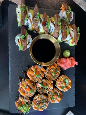 Teriyaki ￼ seduction (orange sauce in photo) & the Heart & Seoul for lunch. Can’t get enough! at Voodu Vegan Bistro in Tampa