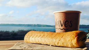 Coffee and a Cornish Sausage Roll  at Waves in Falmouth