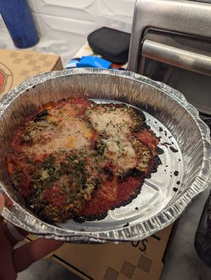 Four thin slices of vegan eggplant Parm for fifteen dollars...... at Ozona Pizza in Palm Harbor