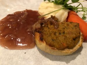 Braised Onion Stuffed with Herb Vegan Sausage, Lyonnaise Sauce, Whole Salt Baked Carrot & Mash at White Rabbit in Todmorden