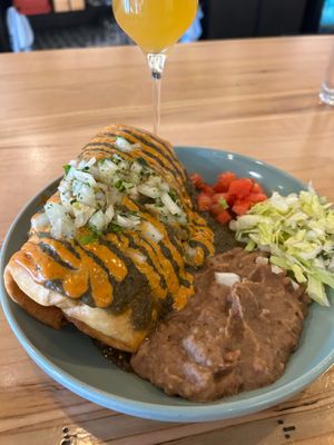 Chimichanga with a zero-proof peach bellini  at Fellow Traveler in Englewood