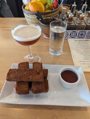 Cinnamon fried breakfast corn bread + billows & thieves n/a drink at Fellow Traveler in Englewood