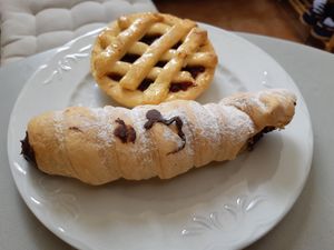 Quince tartlet at the back, chocolate puff pastry cone at the front at Coronados Panaderia Pasteleria & Take Away in Valencia