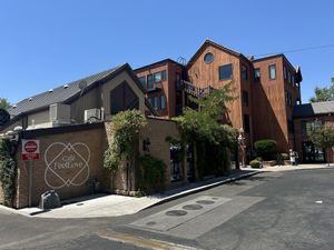 Outside, near a gorgeous tall wood building, in the historical district   at FeelLove in St George