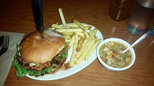 The nights special. Burger included mac  uncheese and onion straws! at Cornbread Cafe in Eugene