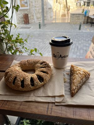 Olive koulouri, baklava and an oat latte  at StoArtos Coffee Bakery in Larnaca