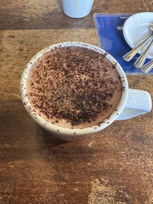 Hot chocolate with oat milk   at Boston Tea Party in Plymouth