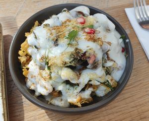 VEGAN PALAK PATTA CHAAT: Crispy & fried battered spinach leaves, Mint, tamarind & vegan yogurt at Delhi House Cafe in Manchester