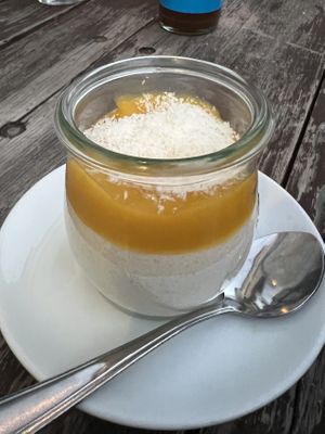 Kokos-Grießpudding mit Mangopüree  at Baobab in Darmstadt