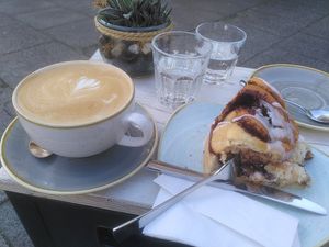 Large cappuccino with oat milk and a cinnamon roll at Herr Liebig Kaffeehaus in Dortmund
