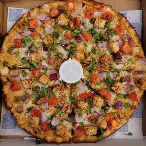 Vegan Butter Chicken Pizza Twist!

This pizza has our signature vegan butter sauce, signature vegan cheese, vegan chicken, fresh crisp red onions, juicy tomatoes, fresh cut; garlic, ginger & green chillies, garnished with fresh cilantro. at Pizza Twist in Fairfield