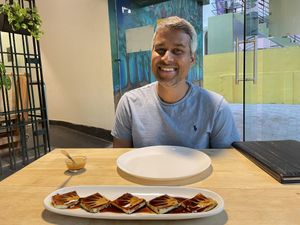 Unique appetizer with a coffee sauce  at The Viridian Plate in Chennai