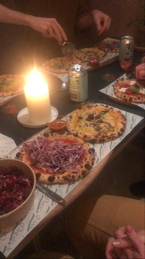 Pizza plate with a "half" salad to the left at Pico Pizza - Vesterbro in Copenhagen