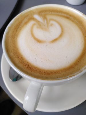 Decaf oat latte (July 2023) at Laughing Llama Coffee & Bistro in York