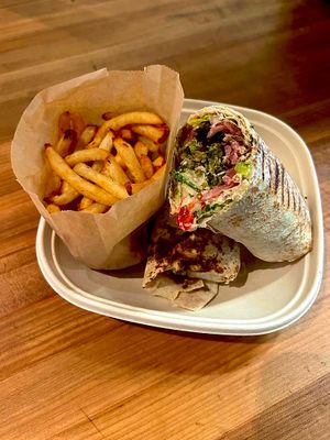 Falafel Wrap: 

Panini Pressed Lebanese Wrap • Happea's Warm Creamy Hummus • Air Fried Crispy Falafel • Romaine Lettuce • Cherry Tomatoes • Persian Cucumbers • Pickle at Happea's - Aventura in Miami