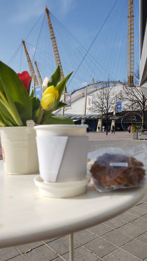 Coffee and cookie with the O2 in the background  at Manna Eating - Pop up in South East London