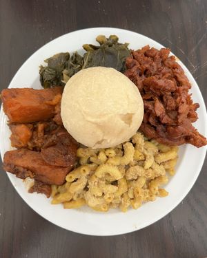 Soul Food Plate-Barbecue chicken, collard greens, yams, mac and cheese, and a roll  at Vegelicious Antioch in Antioch