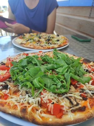 Pizzas 7 and 17 (ask for vegan cheese to make them vegan).   at Pizza Real in Praia Da Luz