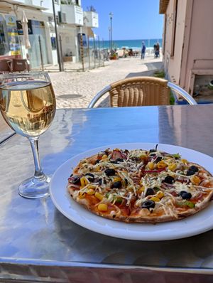 The small size vegetarian pizza with vegan cheese. at Pizza Real in Praia Da Luz