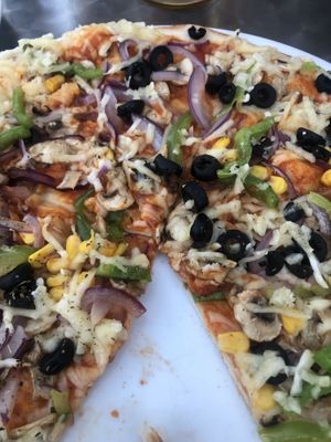 Veggie lovers with vegan cheese  at Pizza Real in Praia Da Luz