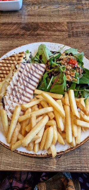 Cheese/chutney panini, salad & fries. at Huggers in Norwich