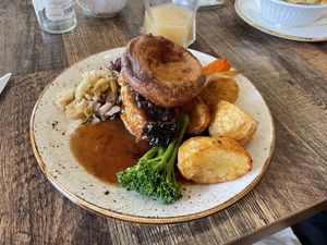 Sage & onion sausage plait with veg, roast potatoes, Yorkshire pud and gravy  at Huggers in Norwich