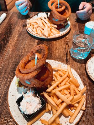 Burgers with onion rings, coleslaw and fries   at Huggers in Norwich
